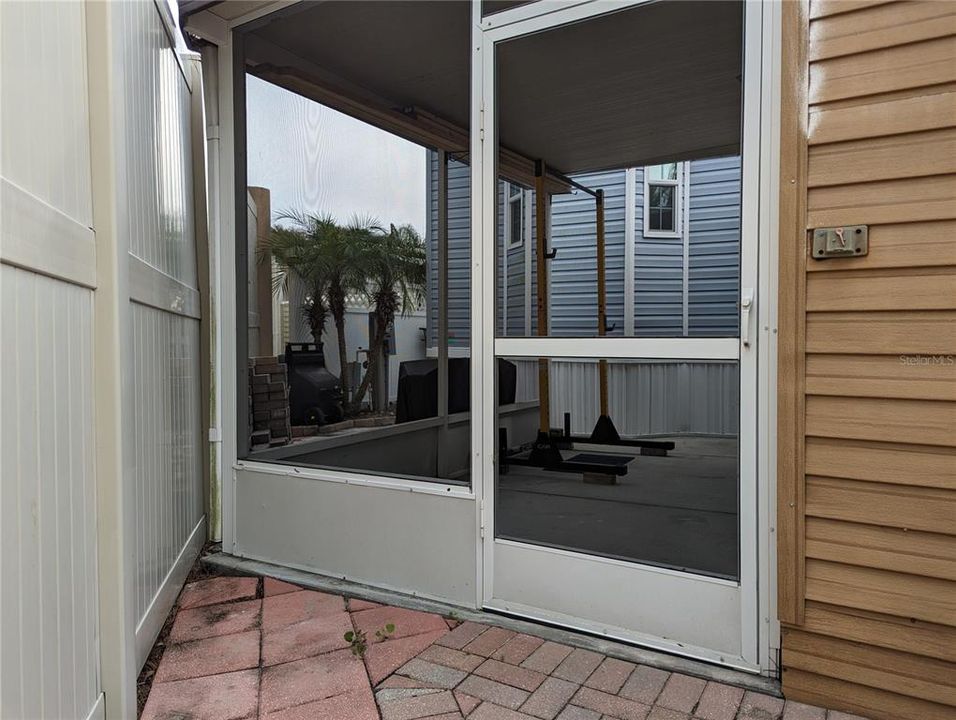 Screen door that leads out to the NorthWest courtyard and shower