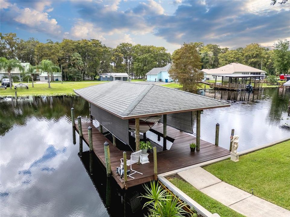 This 33 X 20 boathouse has a 6,000 lb electric lift, running water, and can handle a boat up to 25 feet long.