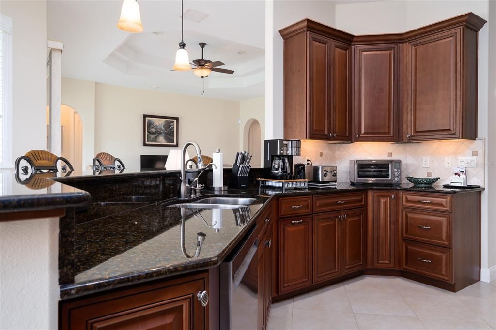 The spacious kitchen is open to the main living area. Many of these cabinets have slide-outs.