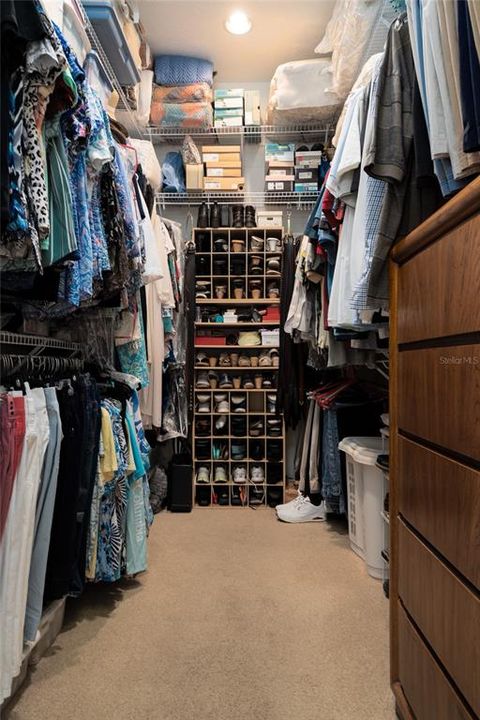 Huge Primary bedroom walk-in closet. Look at all that storage!