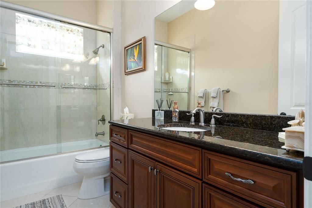 Guest bath near bedrooms 3 & 4 includes a tub/shower combo. All matching cabinets and countertops and upgraded fixtures.