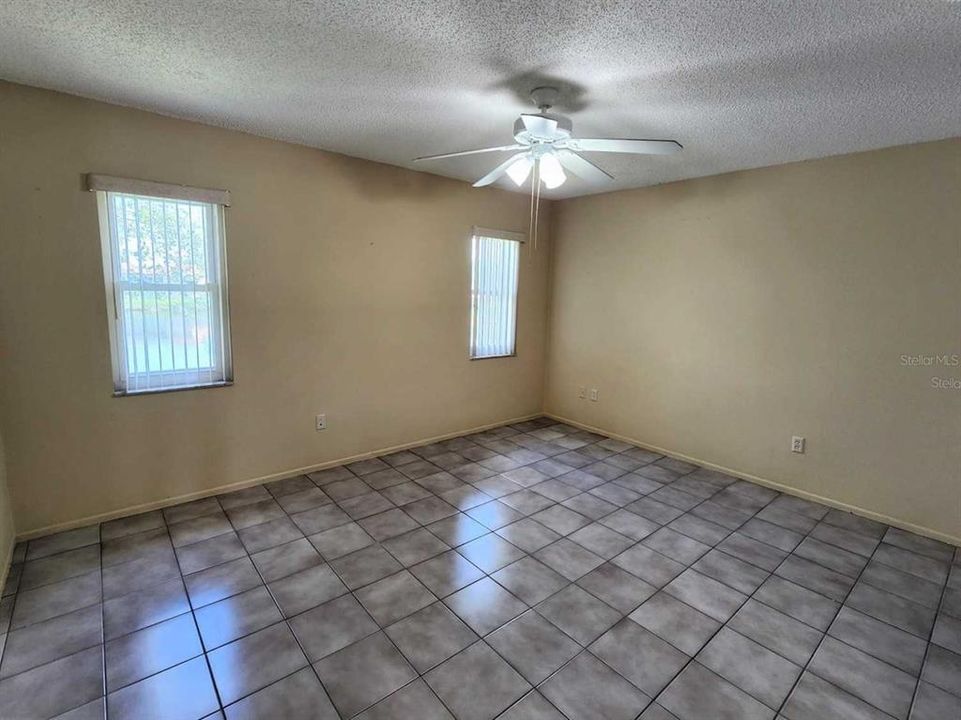 Hall from the master bedroom into master bathroom with closets on both sides