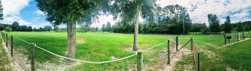 Panoramic view of entry gate and East pasture