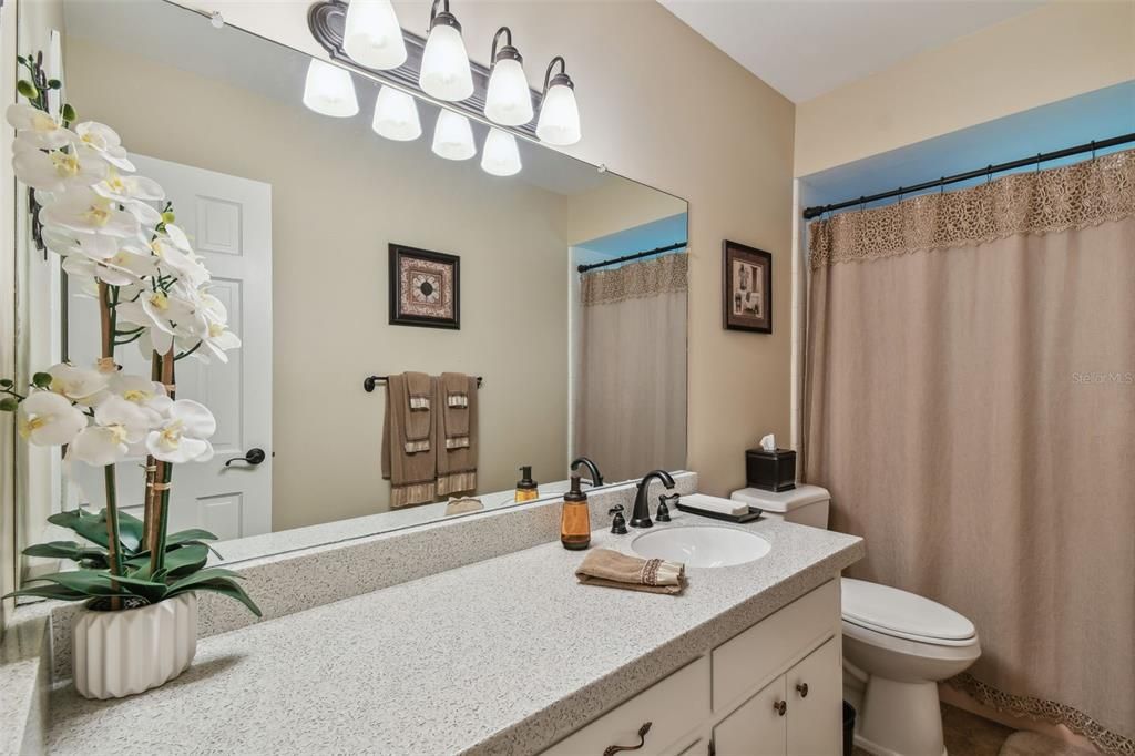 This bathroom has a shower/tub combo!