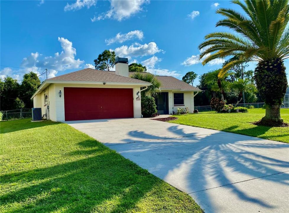 Great Curb Appearance, Screened Entry.....    2 Car Garage with Tropical Pineapple Outside Lights