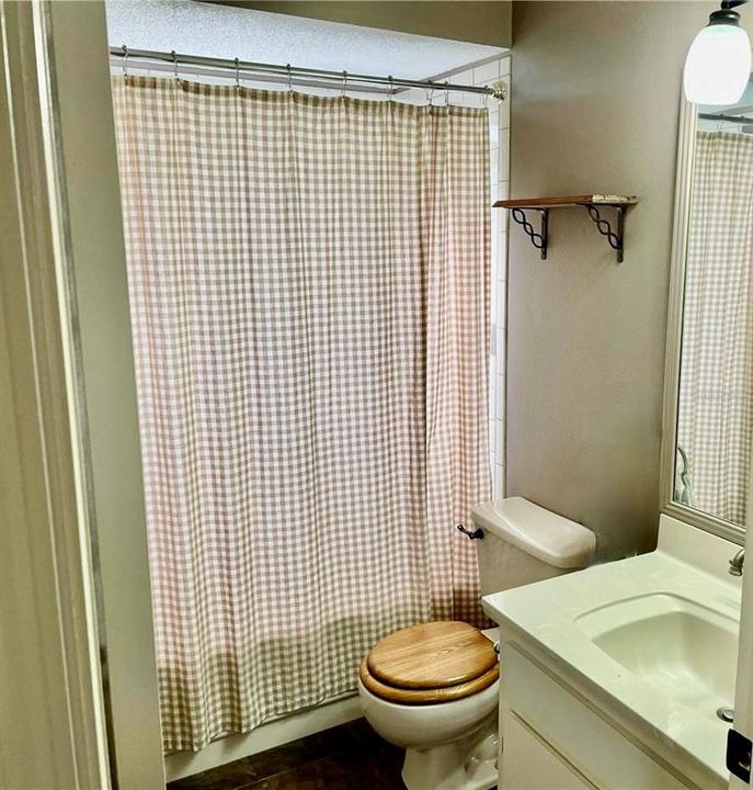 Main Bath with Double Door Vanity, Tub/Shower Combo with Frosted Window