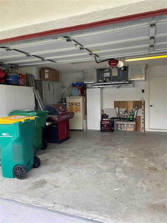 Shows the Depth, plus Door to Interior... Lots of Cabinets for Storage, Work Bench,Some Lawn Tools, Generator, Gas Grill, a Few Items to Start....