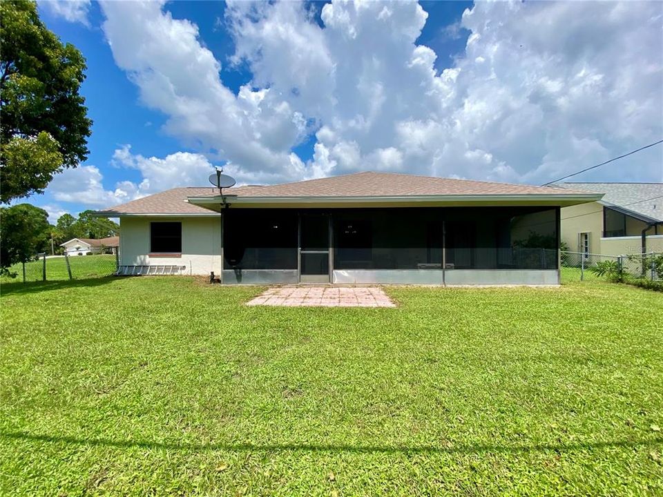 View from the Fence Looking at the Back of the Home, Room for a Swimming Pool if You Desire!!