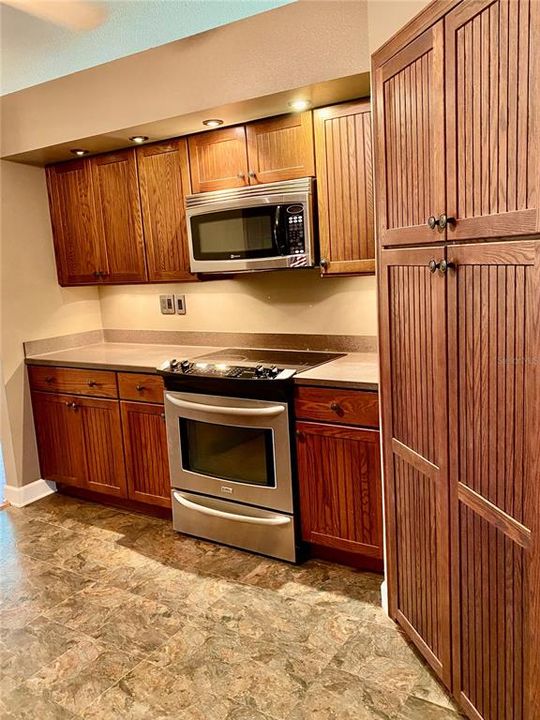 Double Door Pantry with Sliding Shelves!!  Under Cabinet Lighting...Plenty of Cabinets for Storage, Bottom Cabinets Have Sliding Shelf