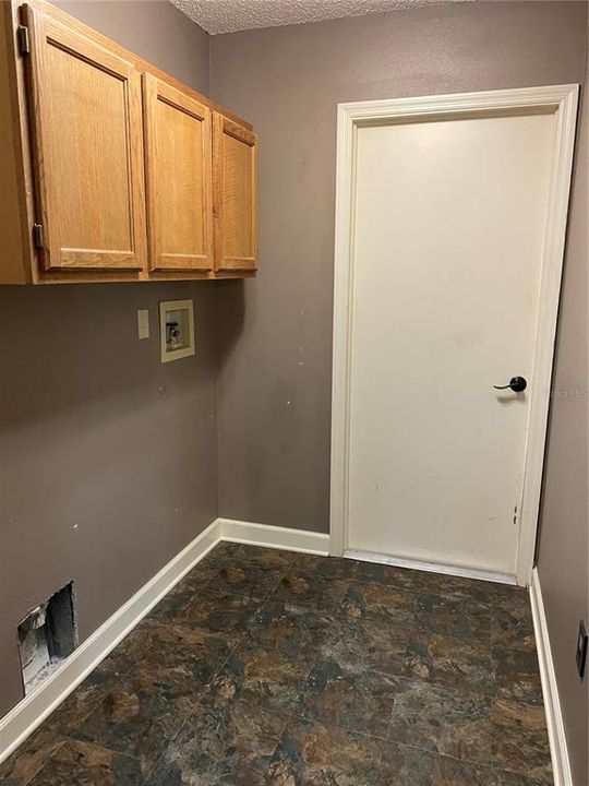 Laundry Room with Storage Cabinets, Hook Up for Washer & Dryer....Pass Thru to Garage