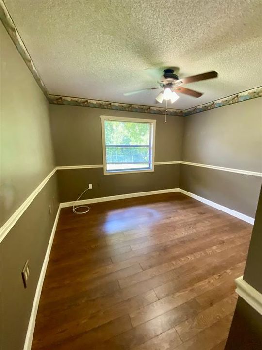 Second Bedroom with Built-In Closet, Chair Rail, Lighted Ceiling FanBeautiful Engineered Hardwood Flooring with Easy Care......