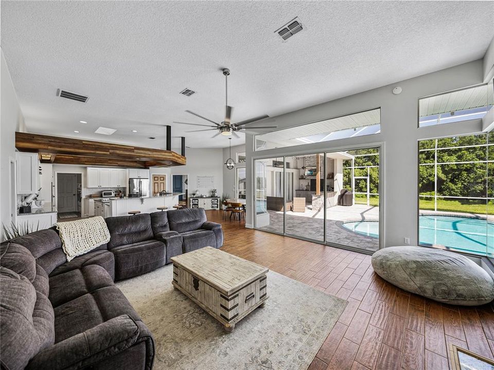 Family room with view of pool and kitchen