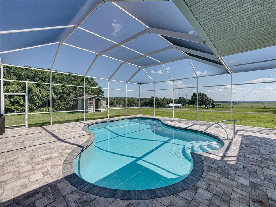 Pool with view of back yard