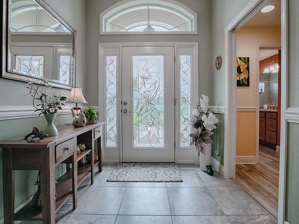 BEAUTIFUL CUSTOM LEADED GLASS FRONT DOOR WITH SIDELITES AND TRANSOM.