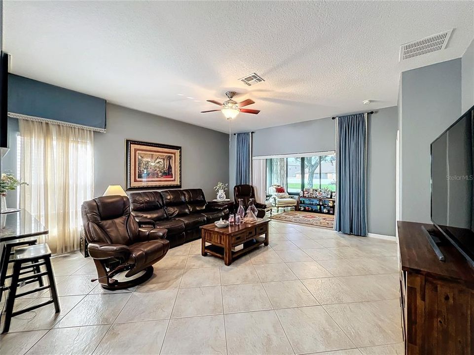 Large family room with breakfast bar and view of the Florida Room.