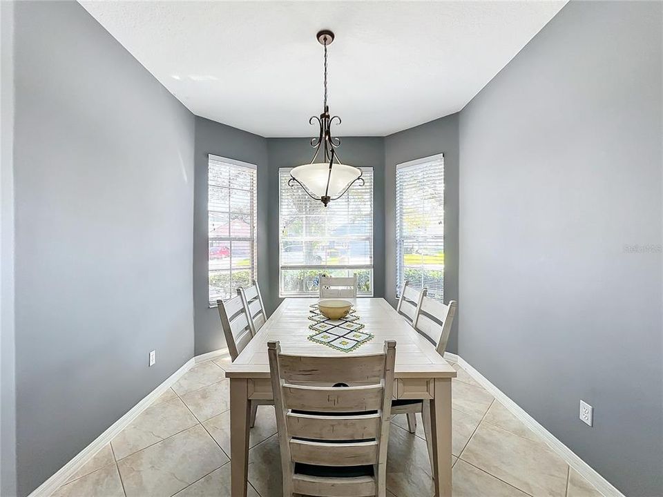 Large dinette area with bay windows.