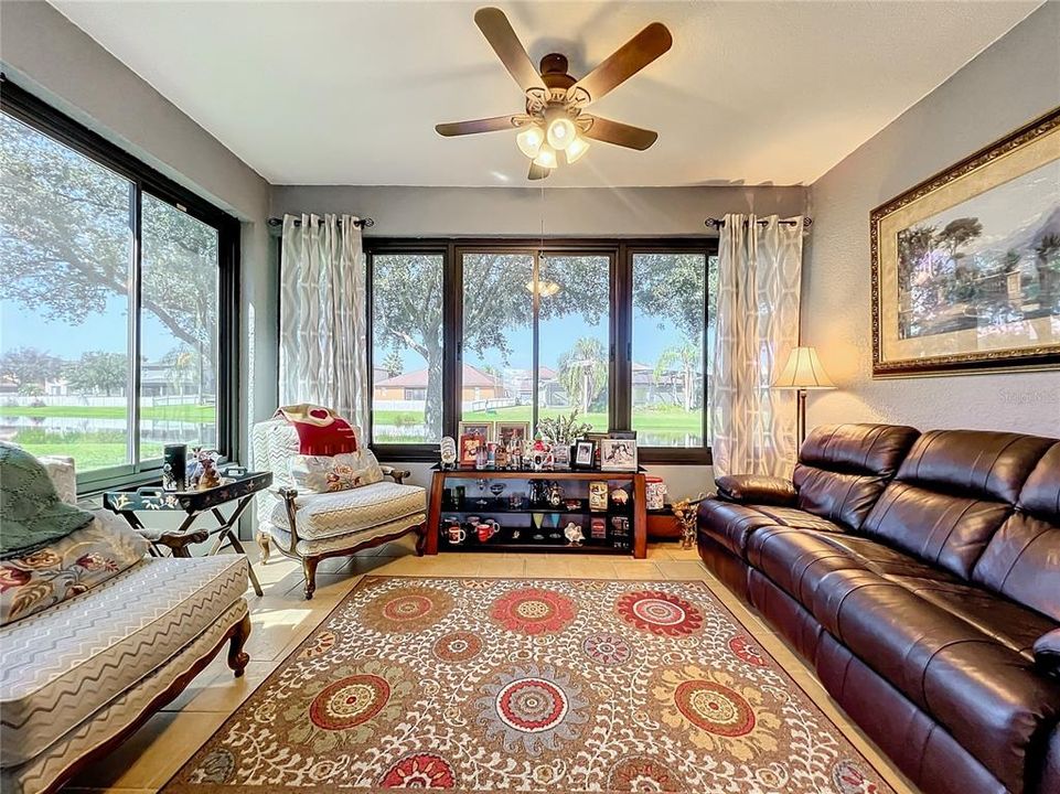 Florida room with serene water view.