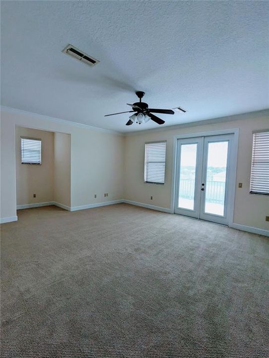 Loft bedroom features walk-in closet with built-in shelves extra utility storage room