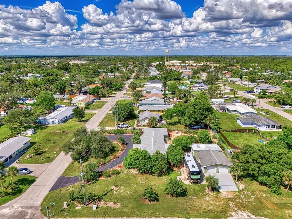 Picture taken from the south side.  Note the large garage with parking for an RV or boat.