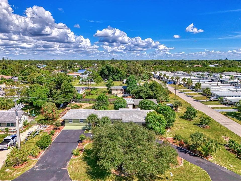 Drone shot of this property.  Plenty of trees surround the home.