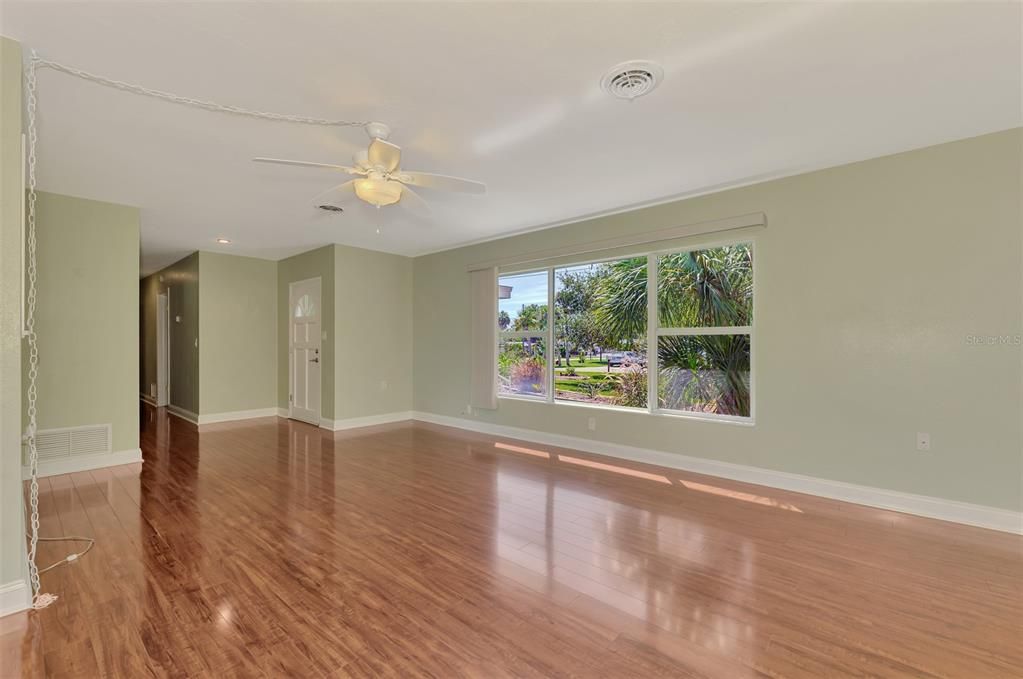 View from the dining area.  Note the shine of the piano laminate flooring.