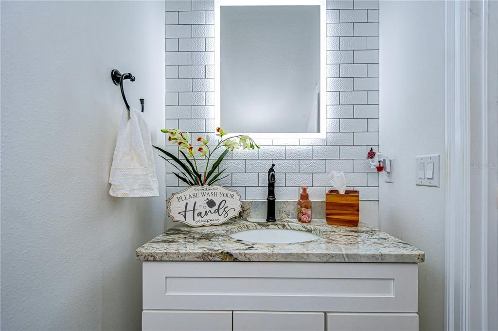 A conveniently located half bath located on the main level is ideal for guests!