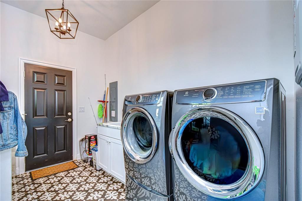 Laundry room with dog wash station!