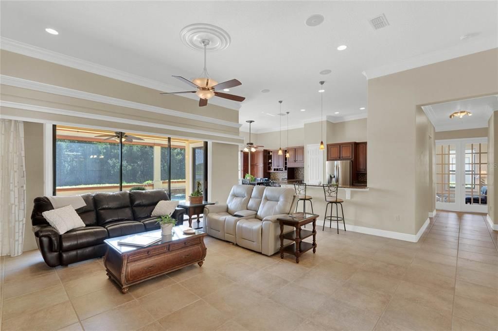 spacious living area that opens to the lanai and pool