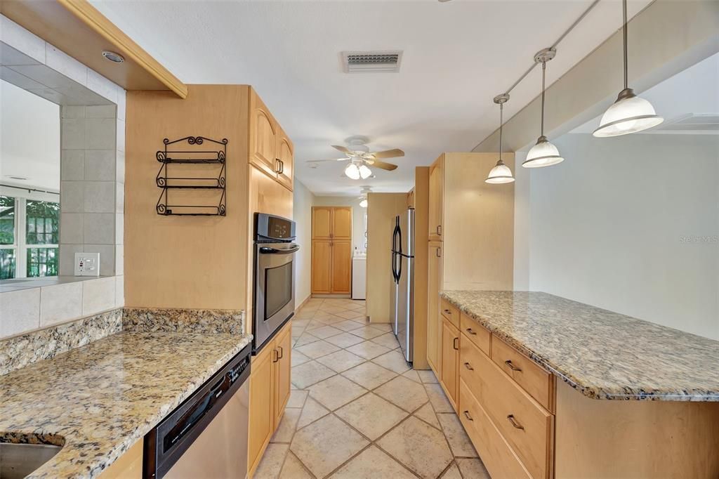 Another view of the kitchen leading to the laundry area