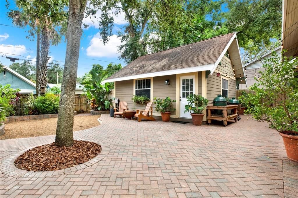 The low maintenance backyard features reclaimed bricks from the original bricklined street