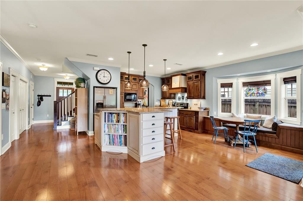 Continuous wood floors run throughout the lower and upper level of the home