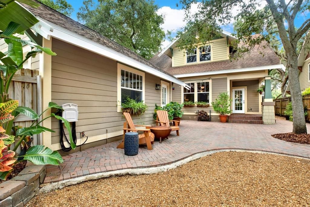 The detached two car garage blends in seamlessly with its window boxes