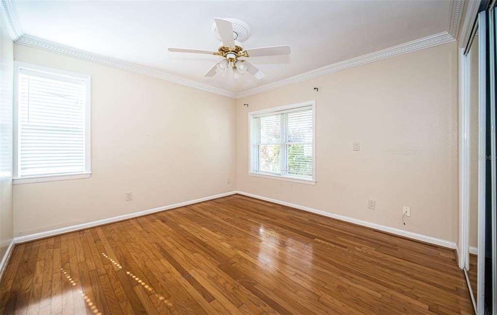 Guest Bedroom 2 in front of home with close and semi-private access to bathroom and extra built in closet