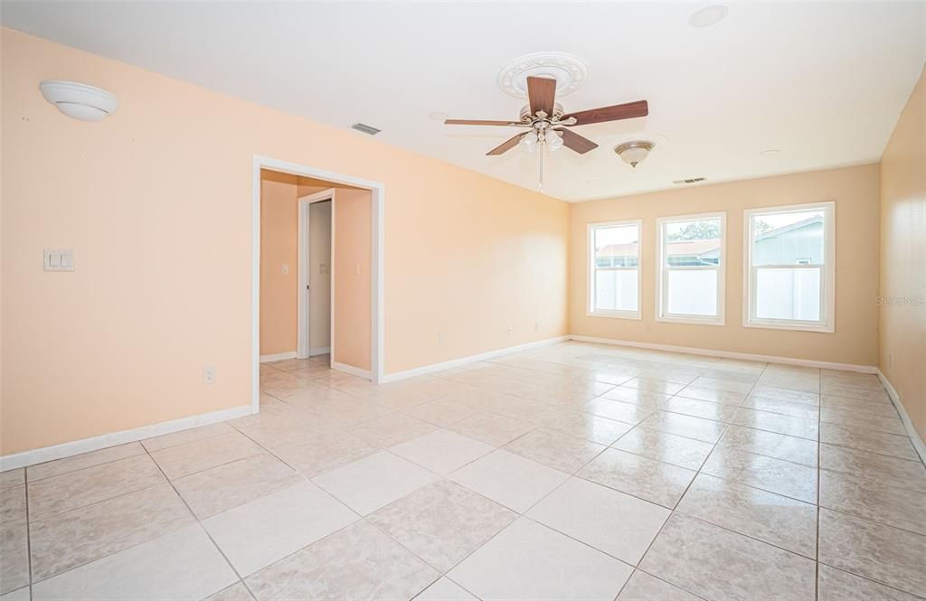 Dining Room/Family Room with Wine Room and entrance to Bedroom 3 with En Suite on left