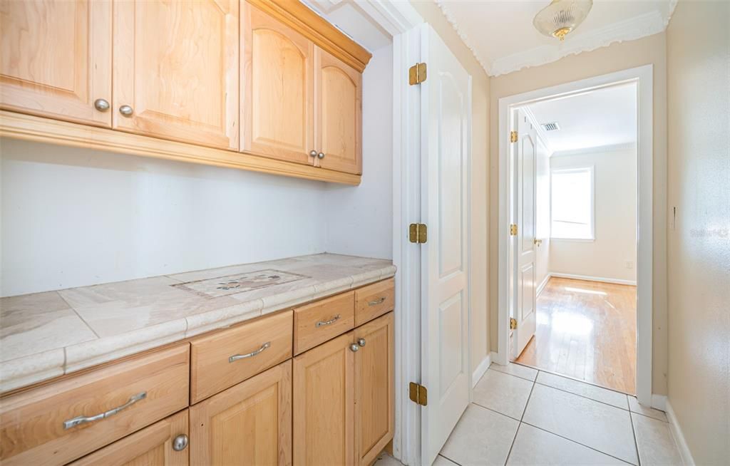 Entrance to Guest Bedroom 2 at front of house with built in closet storage/coffee counter in entry way