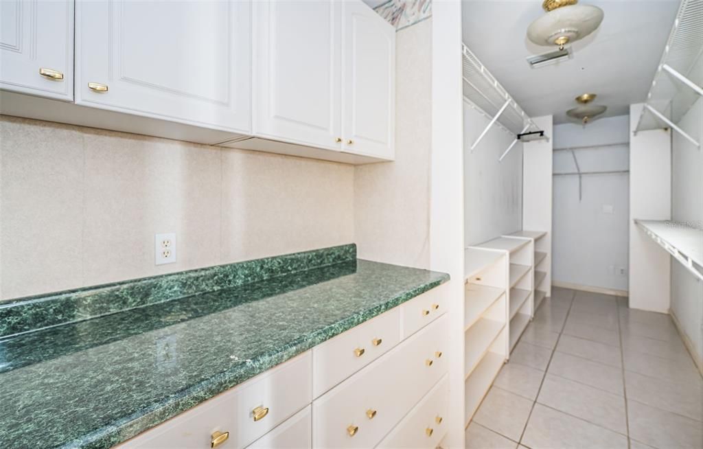 Bathroom next to Bedroom 2 with view of extra built in closet across the way