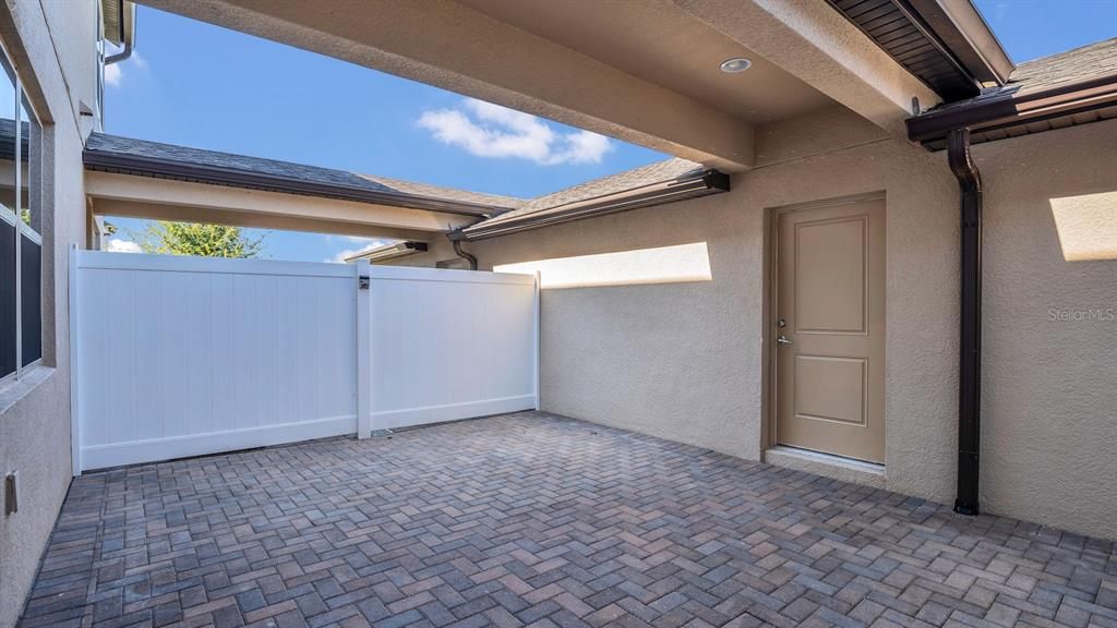 Courtyard - covered area to 2/car garage