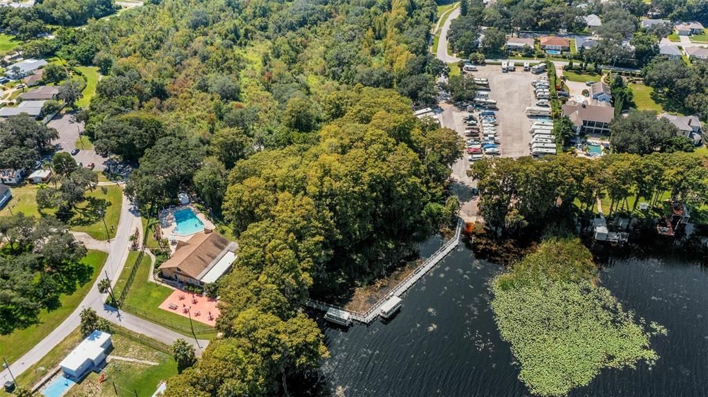 Lake Tarpon Lodge connected to RV lot & boat ramp by an open dock & fishing pier~