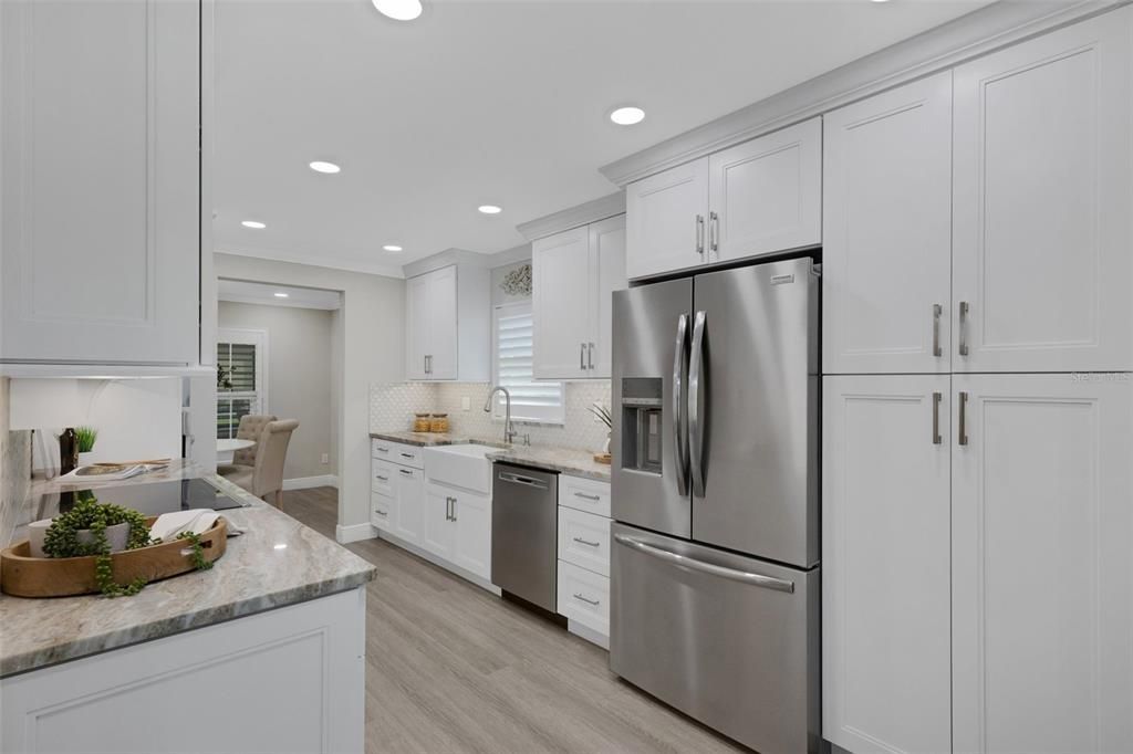 Kitchen was expanded in 2022 with renovations and showcasing LED recessed lighting~