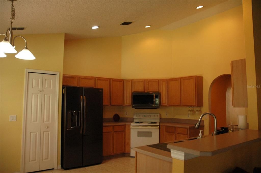 Kitchen also has vaulted ceilings and closet pantry