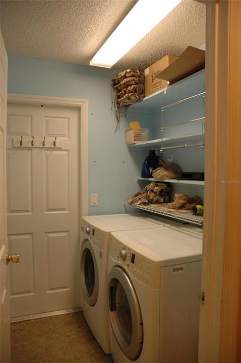 Laundry room comes with washer and dryer with garage access