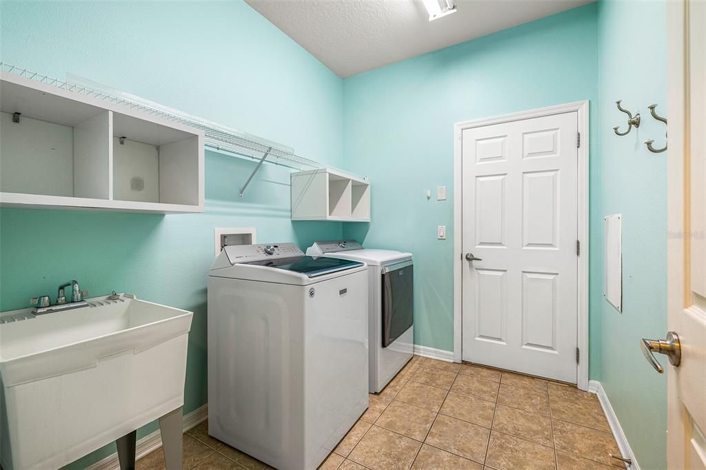 Laundry Room with Landry Sink and Washer/Dryer stays for your ease!