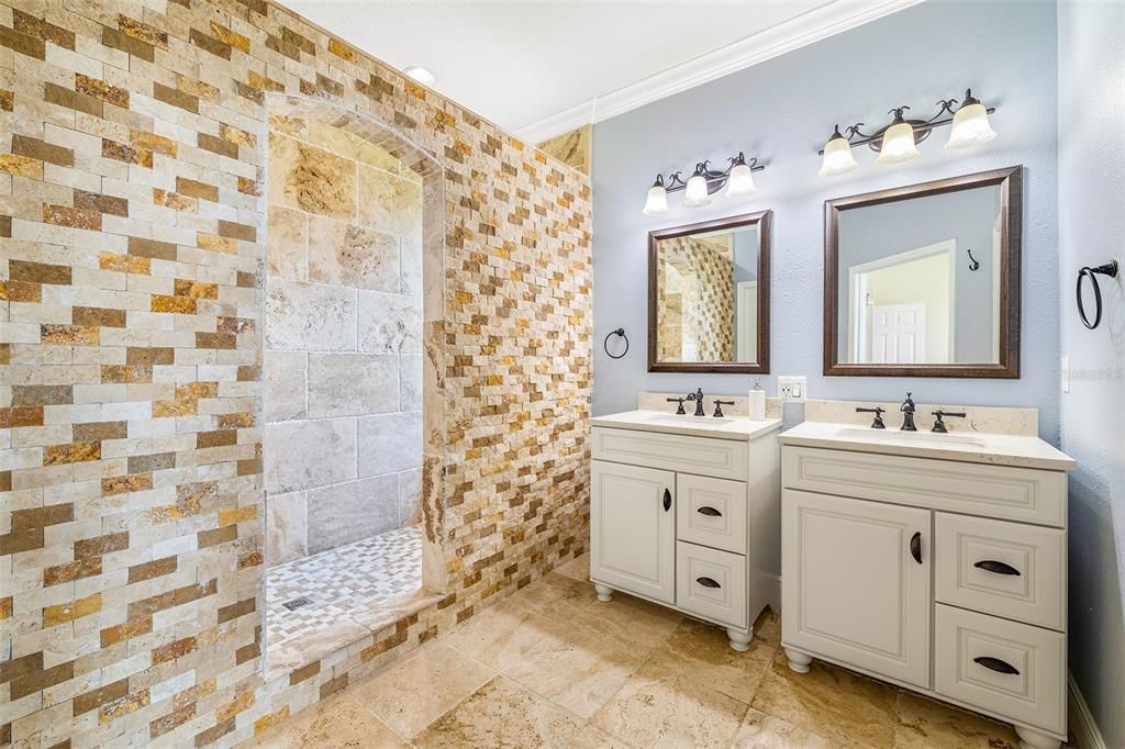 Primary Bathroom with beautiful Stone Work and Double Vanities!