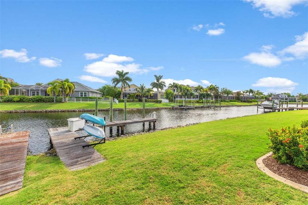 Back yard with view of dock which has electricity and water, just needs a boat lift