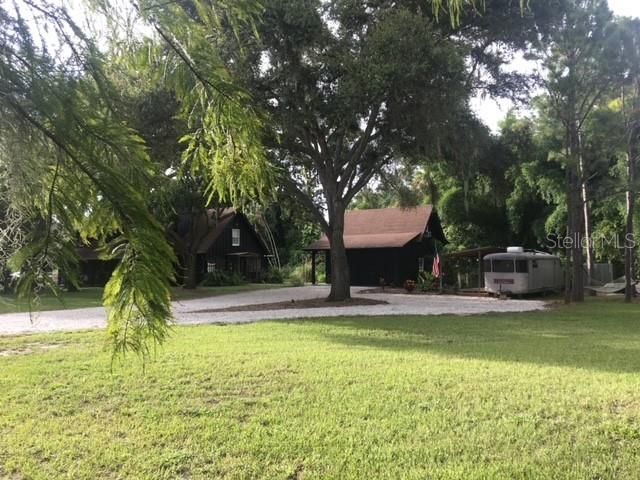 view of guest cabin and trailer