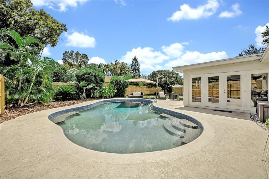 Heated pool with quick access to 1/2 bath