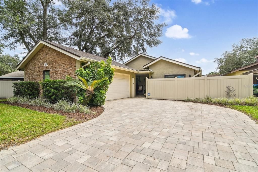 MOVE-IN READY and perfectly situated off a quiet street in the Wedgewood Golf Villas, this unique Tuskawilla home has 3-bedrooms, 2-full baths, OPEN CONCEPT living and dining areas under VAULTED WOOD SLAT/BEAM CEILINGS, WOOD LOOK TILE FLOORS throughout and a large FLORIDA ROOM for added flexible living space!