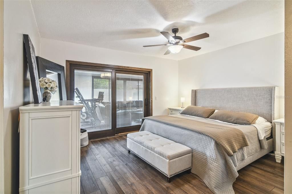 The three bedrooms all feature sliding glass doors including your generous PRIMARY SUITE complete with a WALK-IN CLOSET and private en-suite bath.