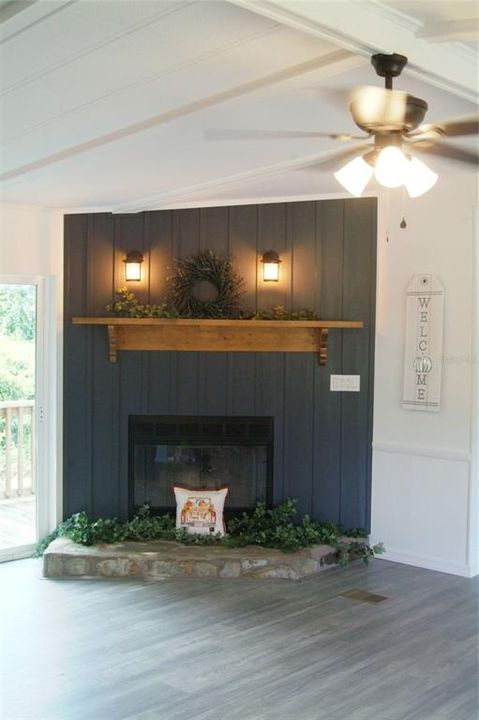 Custom Fireplace with Wooden Wall and Mantle with Stone Hearth