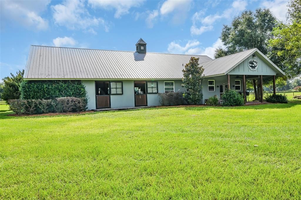 NW Ocala, 10.58 Acres, 2 barns, grassy pastures, gated entry.